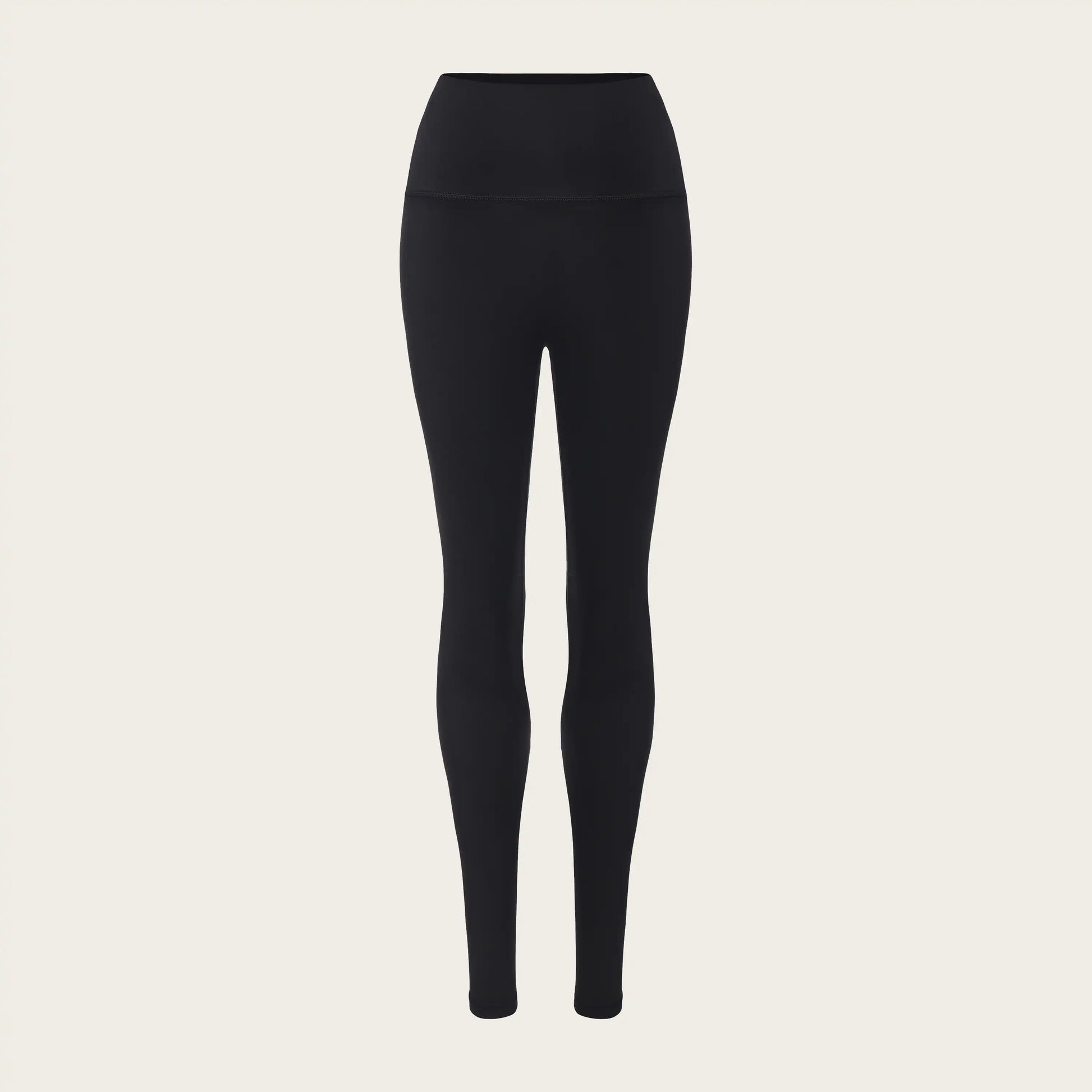 Unstoppable Collective Black leggings on a beige background