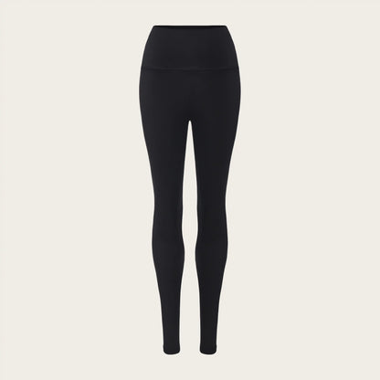 Unstoppable Collective Black leggings on a beige background