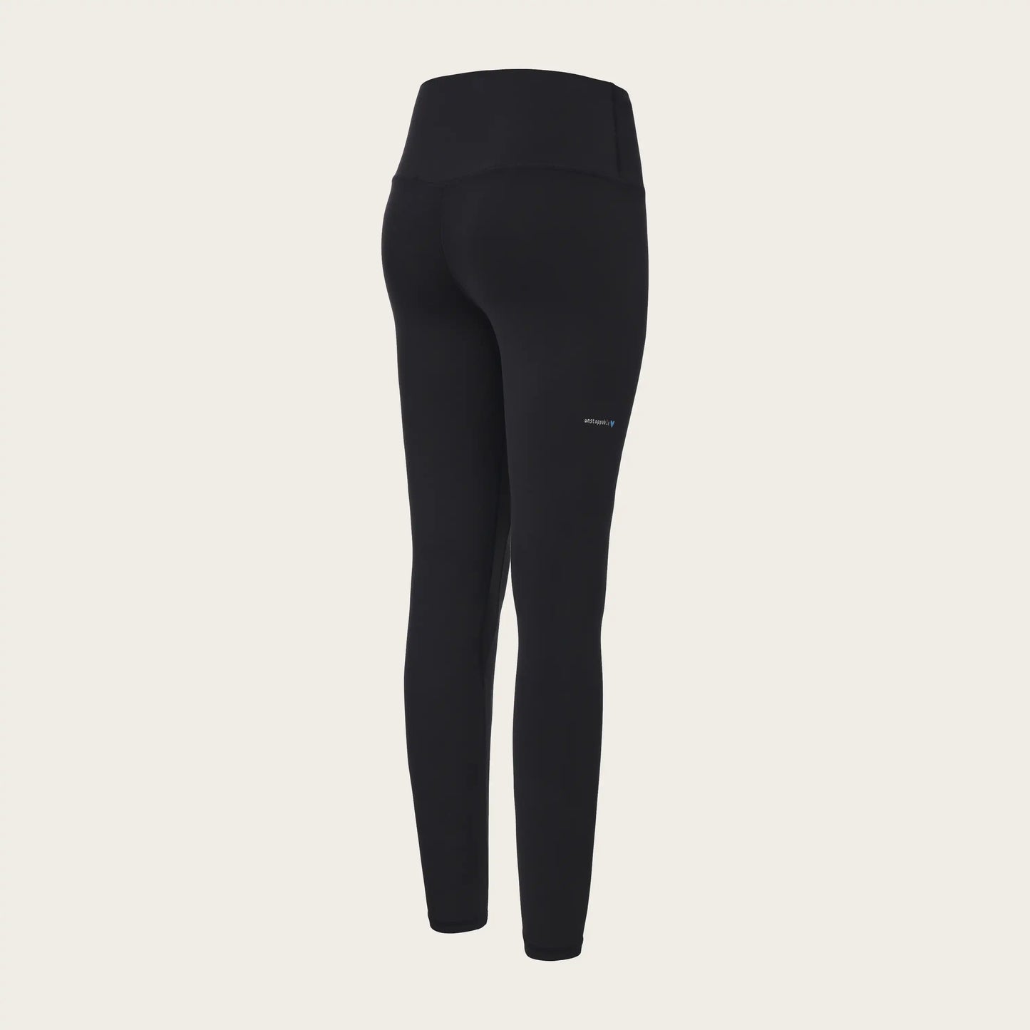 Black leggings on a beige background