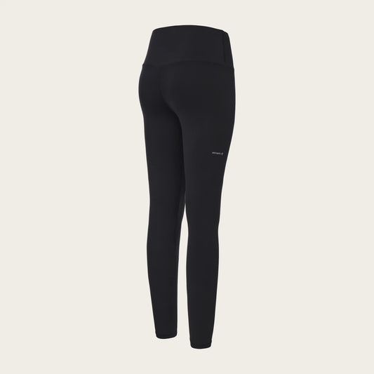 Black leggings on a beige background