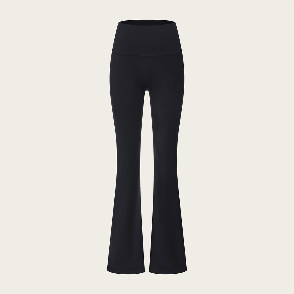 Black flared pants on a beige background