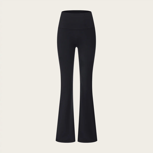 Black flared pants on a beige background