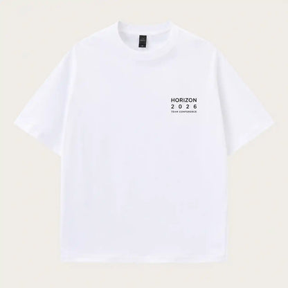 A white short-sleeve crewneck t-shirt with a small black graphic on the left chest reading 'HORIZON 2026 TEAM CONFIDENCE', displayed flat against a light beige background.